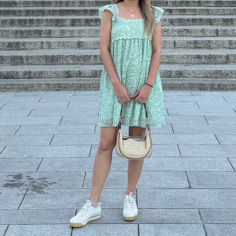 Green mini dress with ruffle sleeves